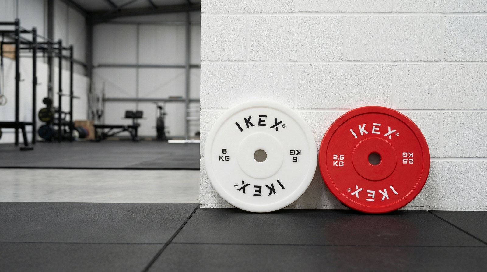 Discos técnicos IKEX: disco rojo 2,5 kg y blanco 5 kg juntos
